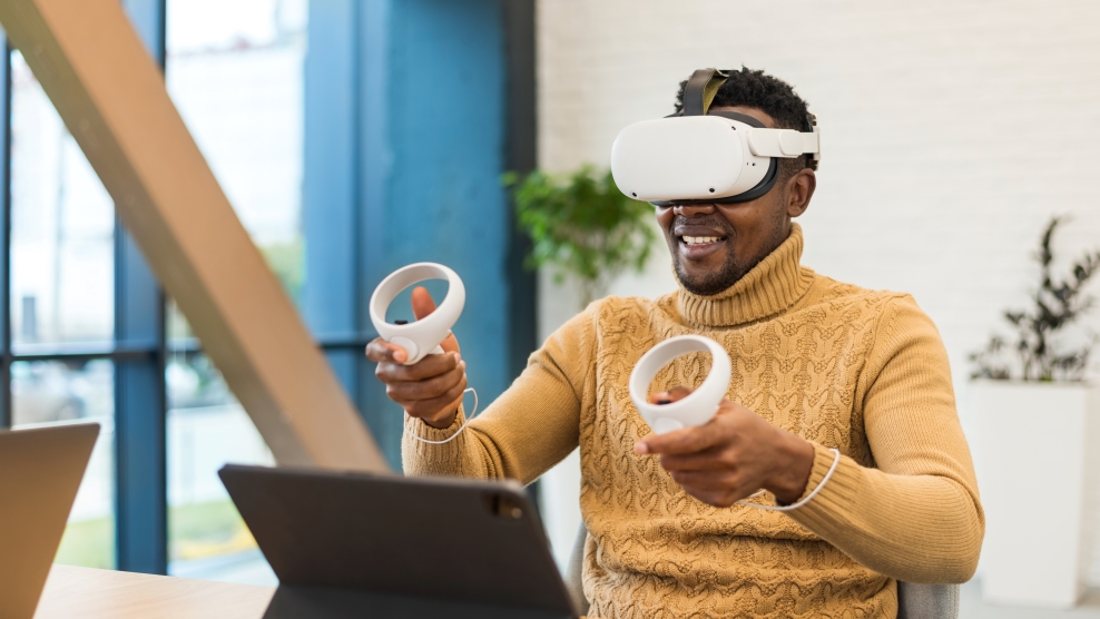 Excited black man exploring virtual reality